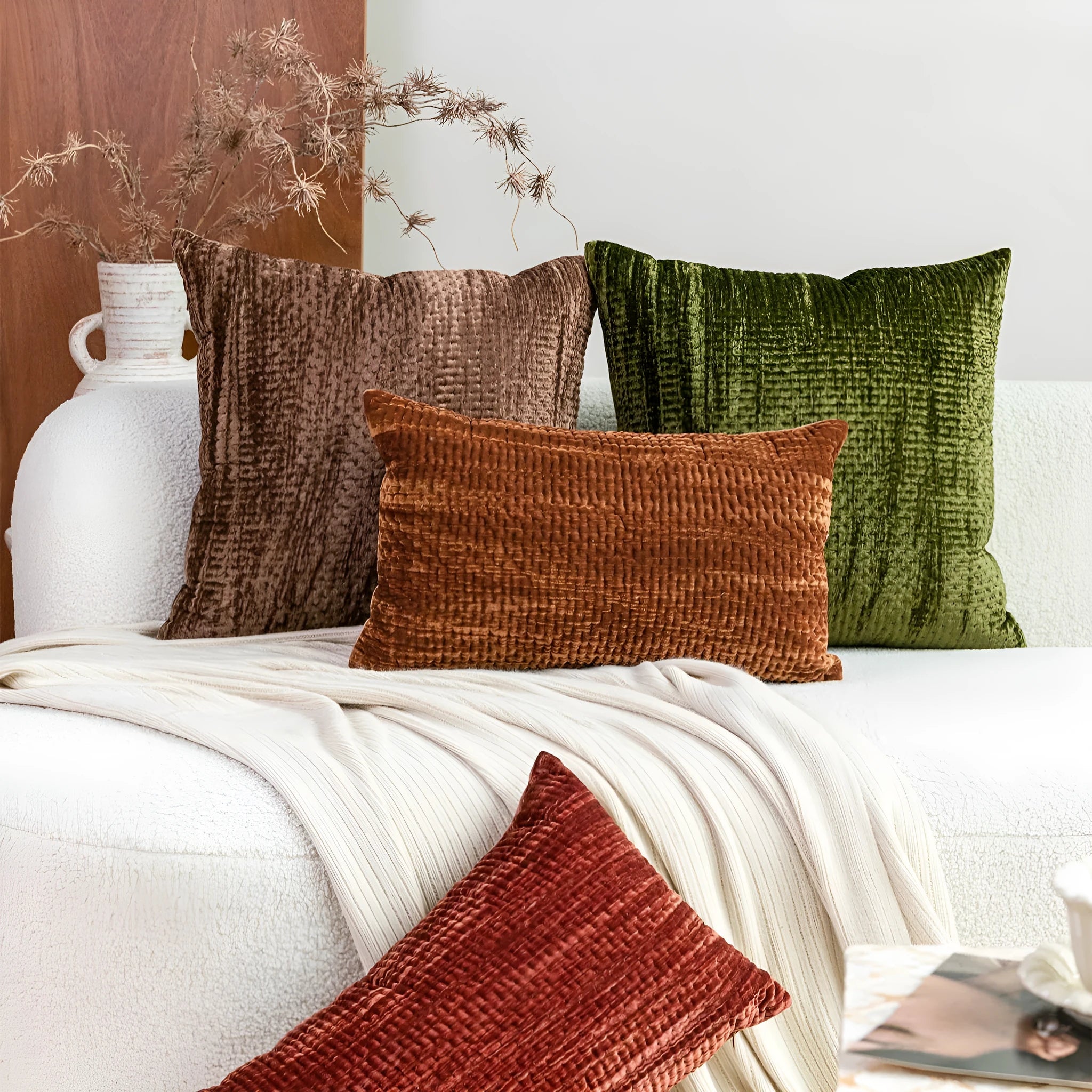 Quilted solid-colour velvet cushion pillow on a sofa, showing square and waist cushion sizes.