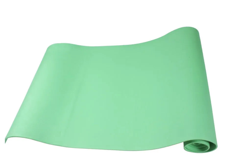 EVA foam yoga mat in blue, showing textured anti-slip surface, with a black OPP storage bag beside it.