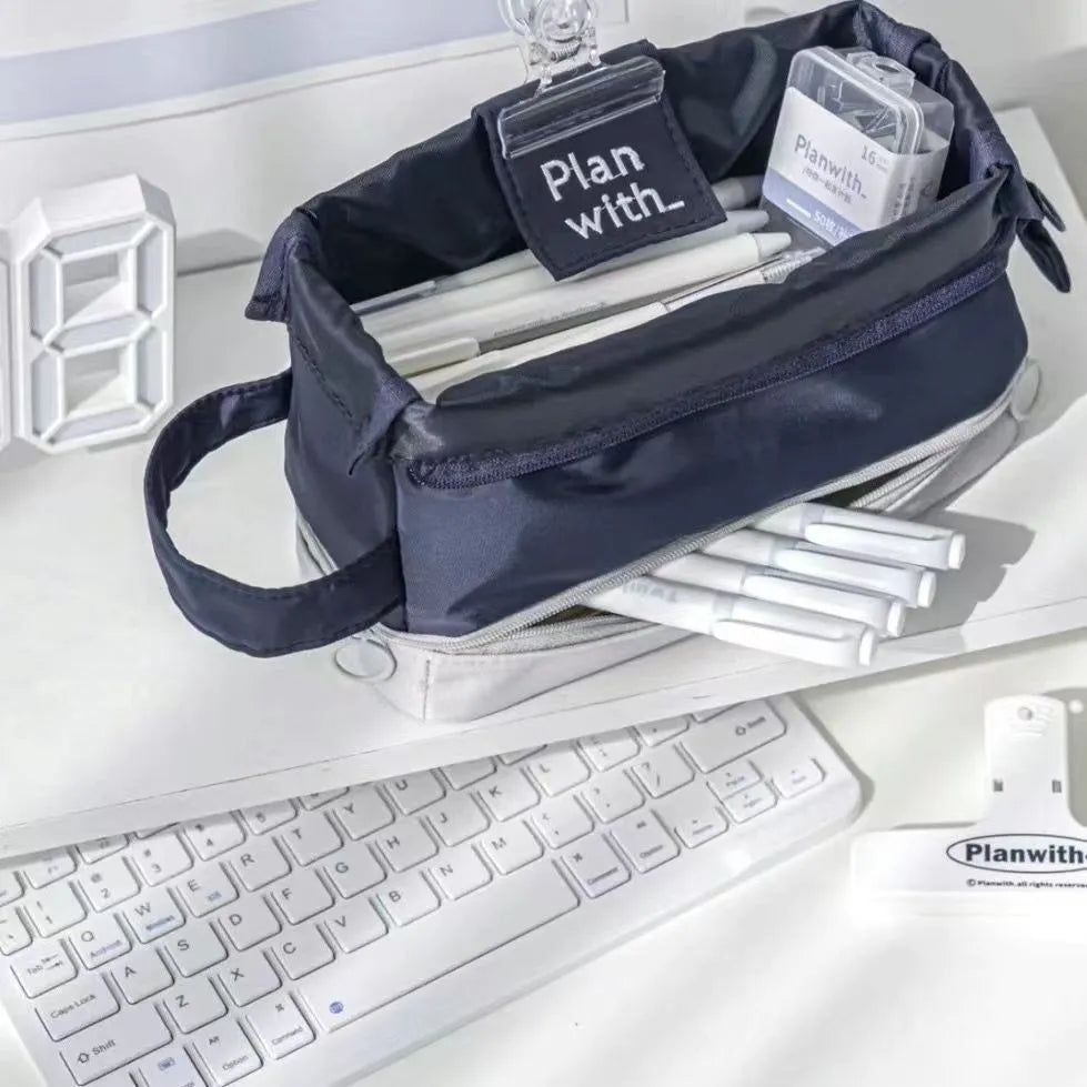 Dark blue foldable double layer student pencil case made from polyester fabric.