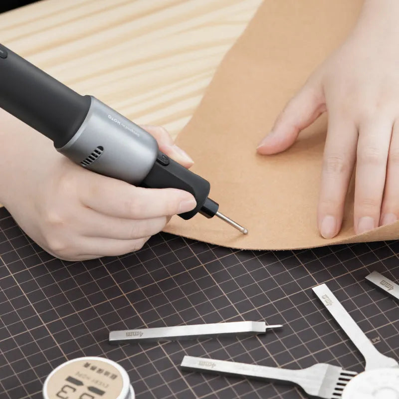 Black hand held rechargeable grinder with USB charging, 3.6V lithium ion battery, and 24-piece accessory set for cutting and polishing.