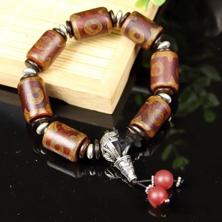 Distressed agate Tibet beads bracelet with three eye dzi design and polished stone beads