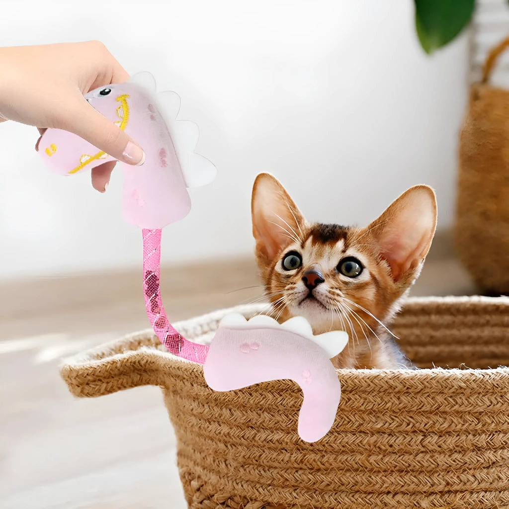 Four cat chew toys including plush mouse, fish, bunny, and chew toy in pink, purple, and yellow colours