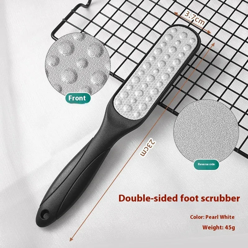 Stainless steel foot grinder with white and black double-sided abrasive attachments for foot care