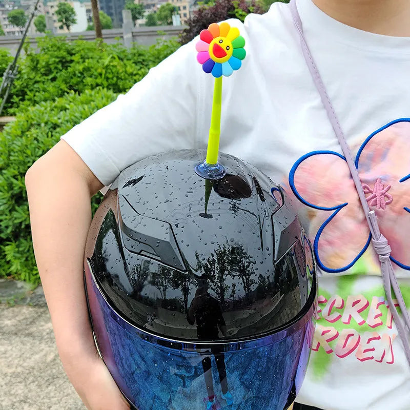 Yellow silicone sunflower decoration with suction cup for helmet customisation.