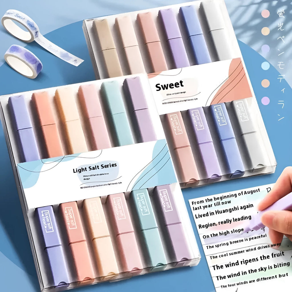 Set of double-tipped fluorescent marking pens in mixed colours on a white background.