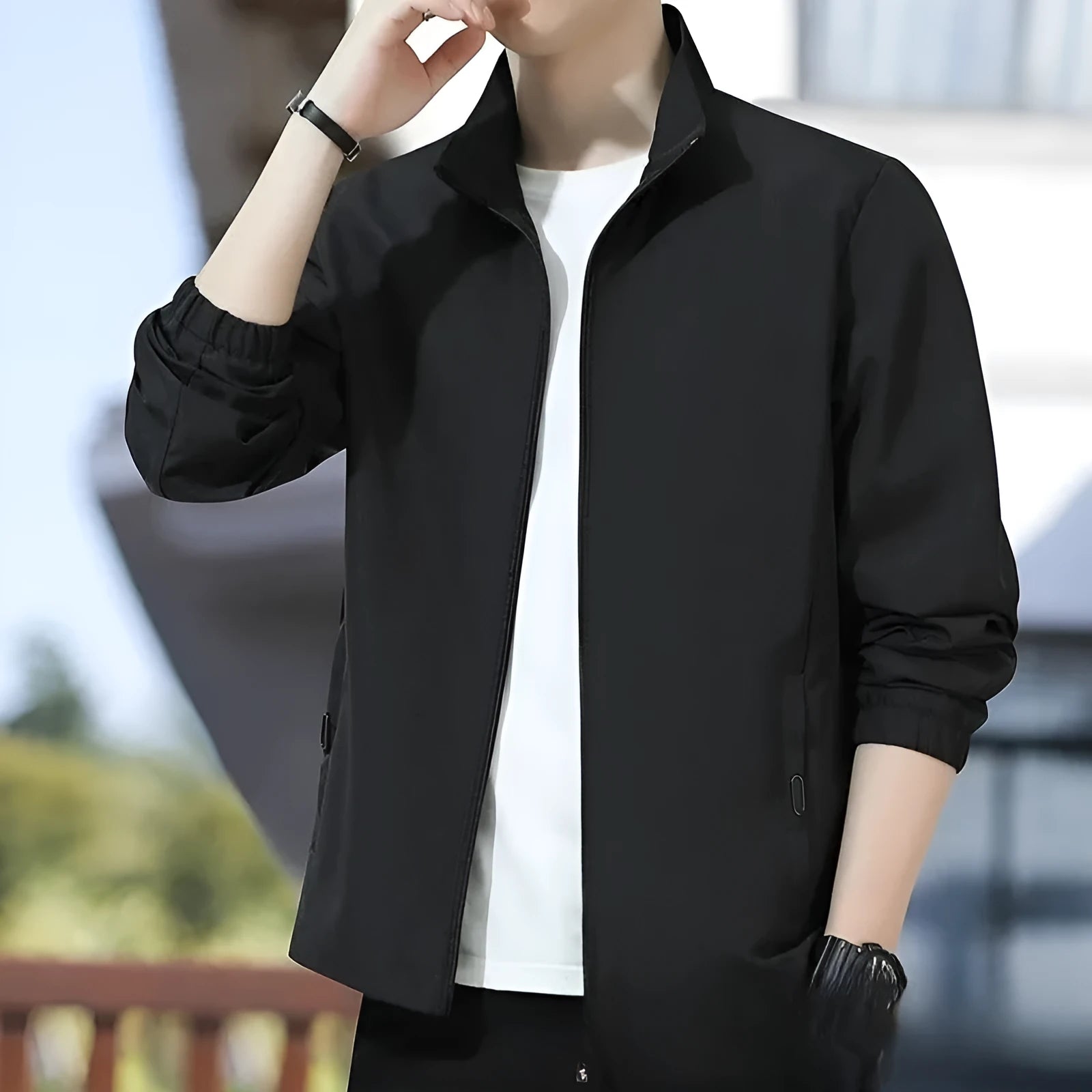 Man wearing a loose-fit Korean style casual jacket in blue, with zip-up front and pocket detail.
