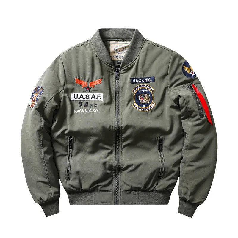 Man wearing a slim-fit black retro motorcycle jacket with stand collar and embroidery details.