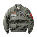 Man wearing a slim-fit black retro motorcycle jacket with stand collar and embroidery details.