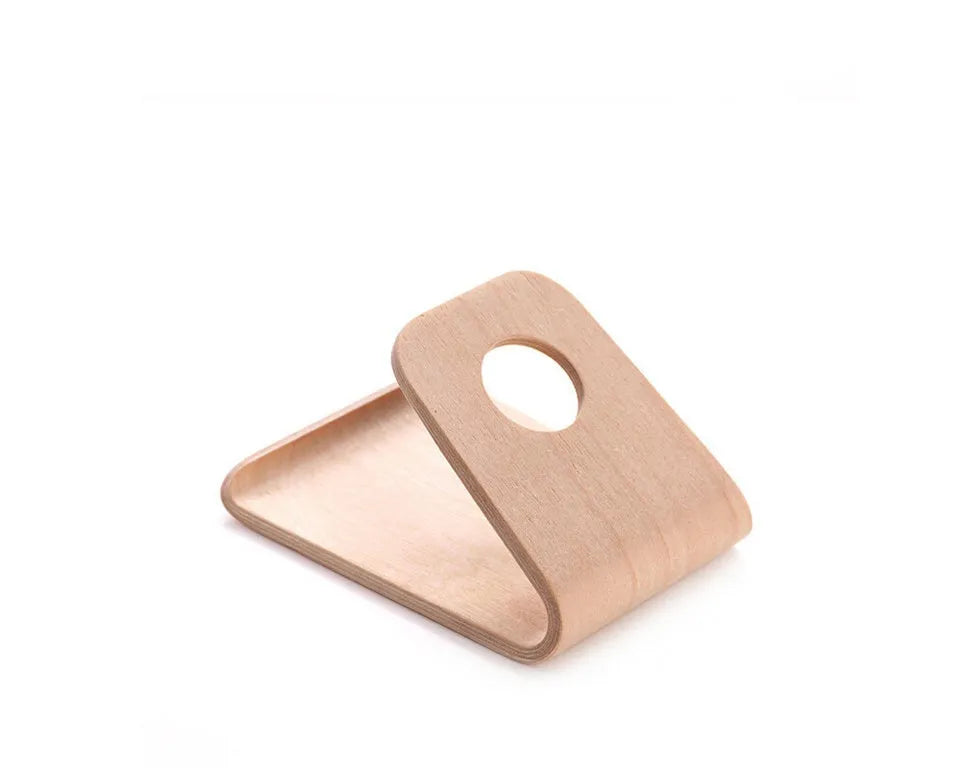 Minimalist wooden iPhone stand in walnut or white maple finish with a cable notch.