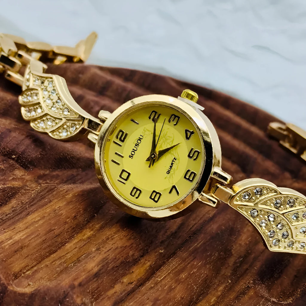 Slim stainless steel women's watch with round dial, shown in gold, black and gold, and white and gold colour variations.