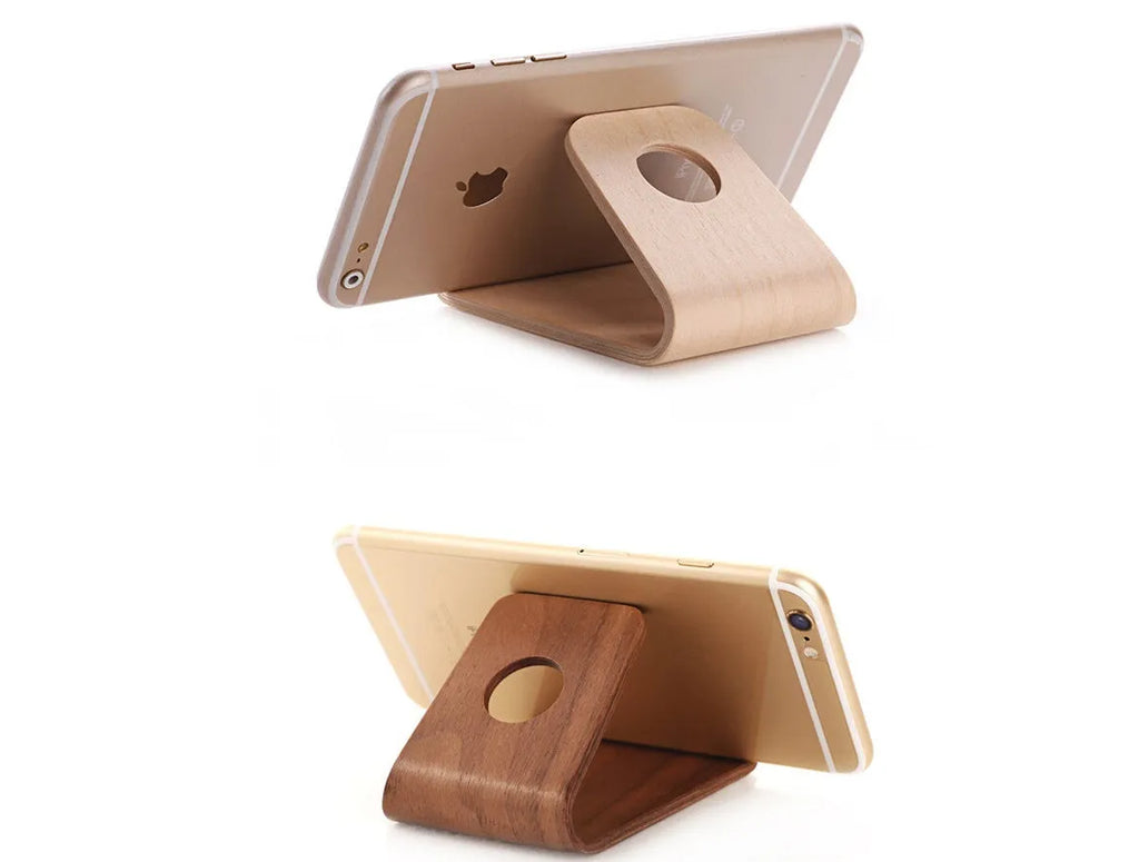 Minimalist wooden iPhone stand in walnut or white maple finish with a cable notch.