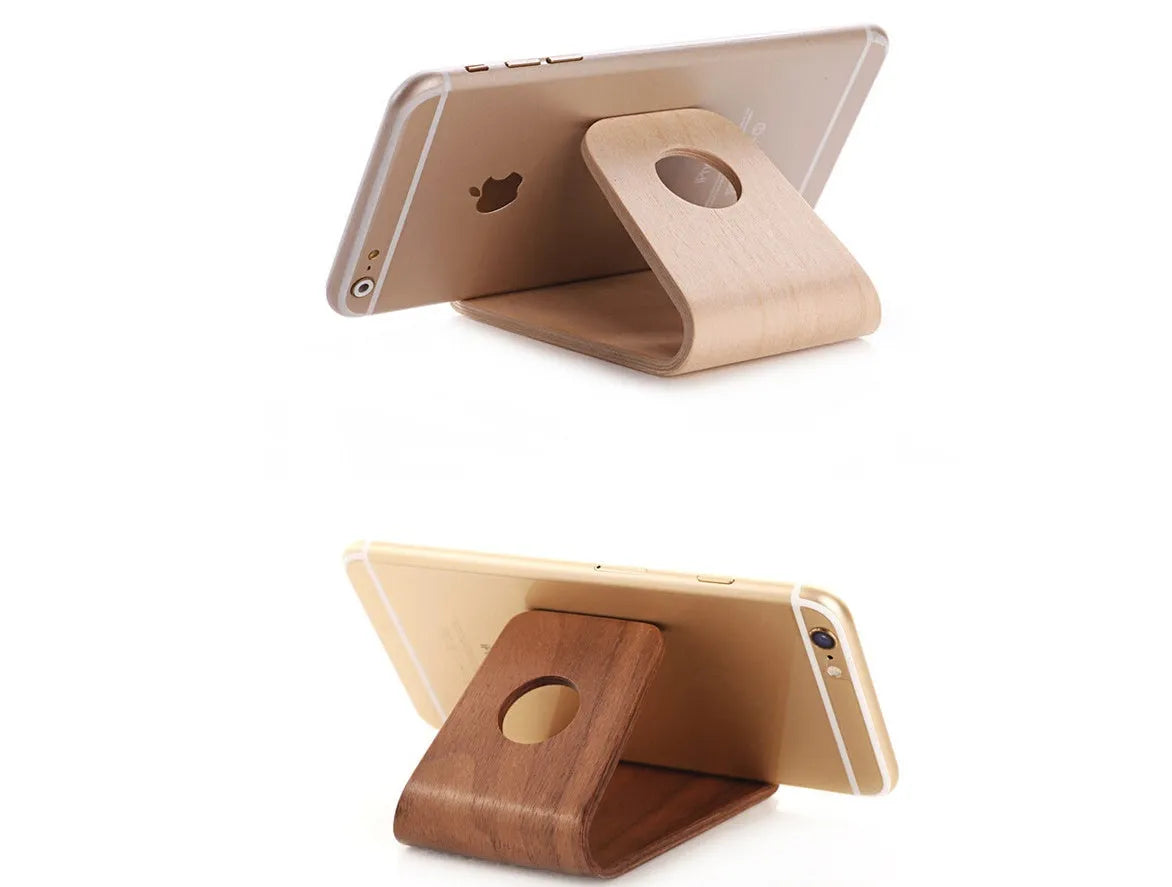 Minimalist wooden iPhone stand in walnut or white maple finish with a cable notch.