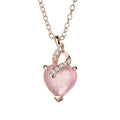 Rose gold women's necklace with heart-shaped pink crystal pendant on cross chain
