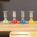 A 7cm geometric trumpet-shaped glass tobacco pipe in transparent blue, green, red, or yellow.