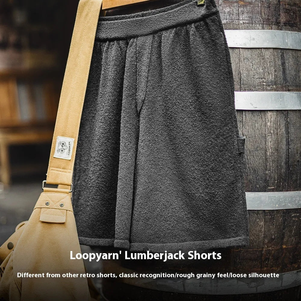 Cement grey American-style loose profile straight-leg sports shorts with elastic waistband