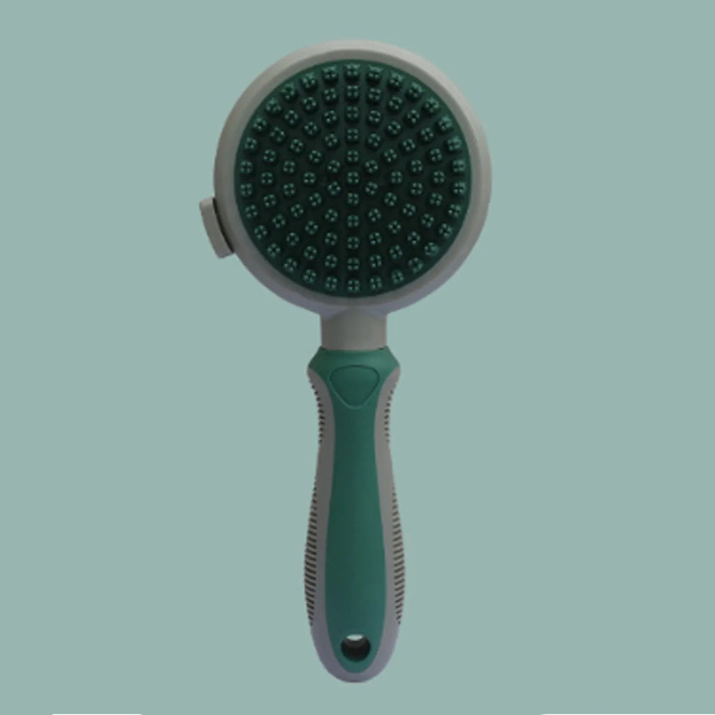 Green and pink double-sided cat brush with release button and flea comb