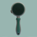 Green and pink double-sided cat brush with release button and flea comb