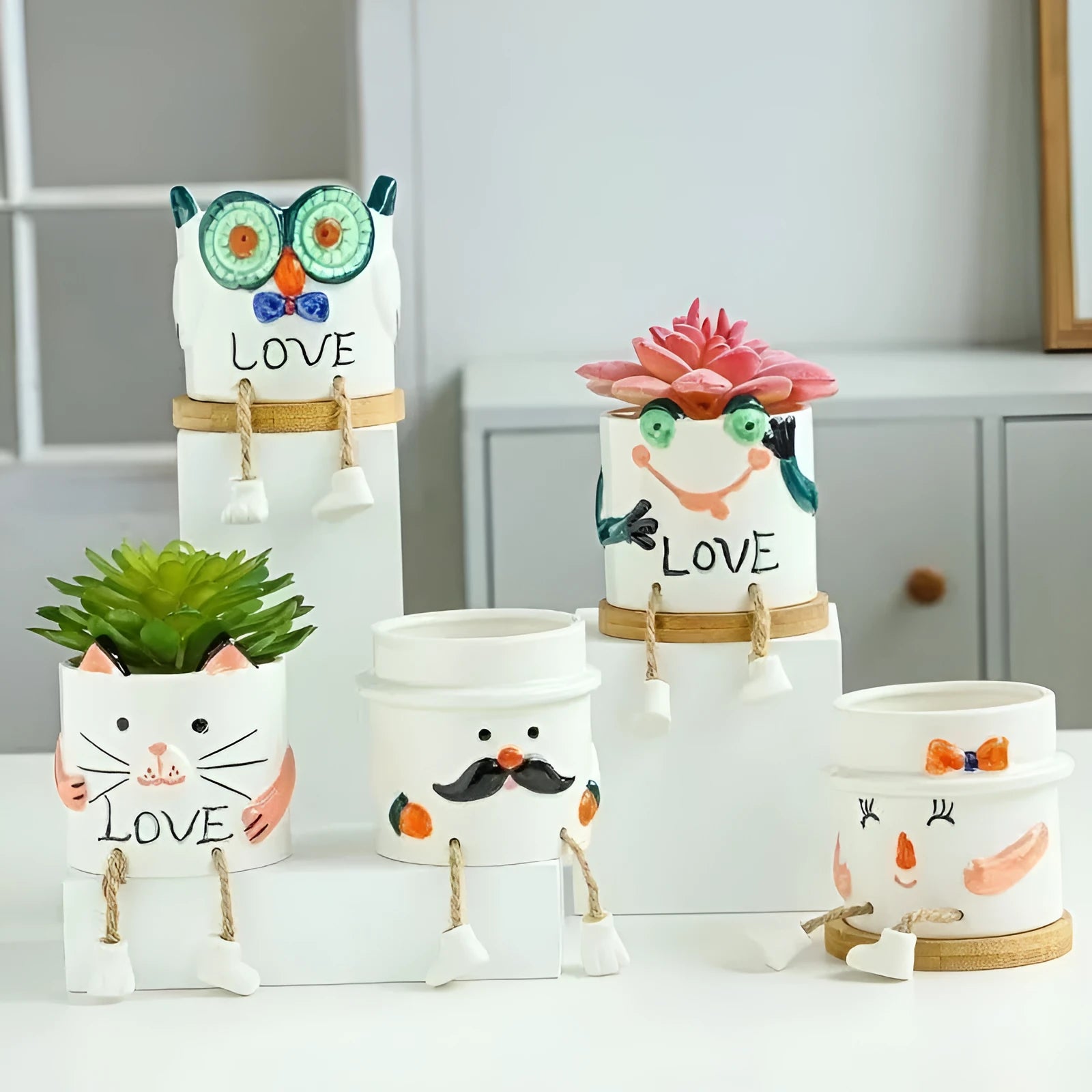 Cartoon style ceramic hanging foot flowerpot for succulents on a desktop