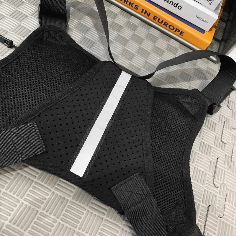 Black nylon tactical chest bag with reflective tooling style, solid colour, polyester lining and sewing thread detail