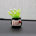 Auspicious fruit potted plant car ornament in a plastic vase, available in black or white, for car interior decoration and odour removal