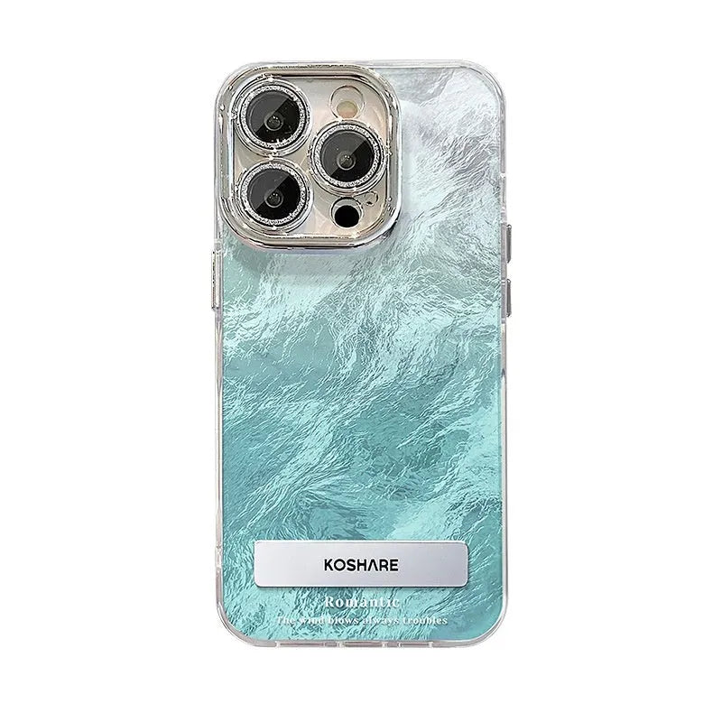 Ice blue gradient hard PC phone case with invisible bracket and silver chain for iPhone set on a white surface