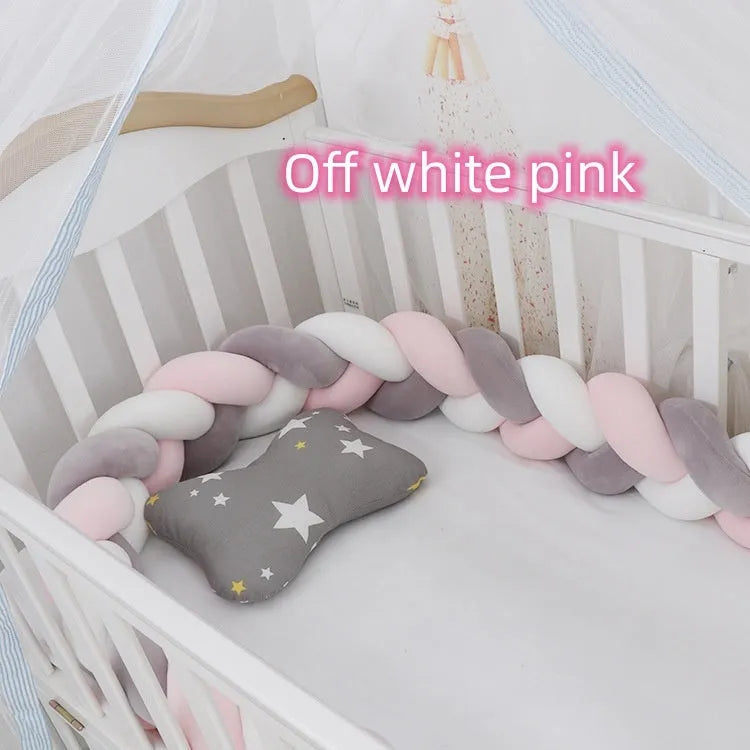 Braided knot style baby cot bumper in spandex crystal velvet fabric, shown in a light grey colour.