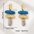 A pair of geometric-shaped stud earrings with a multicolour metallic finish on a plain background.