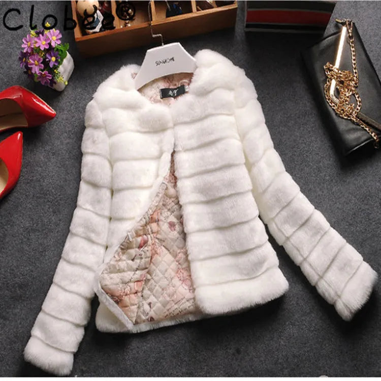 Women's cropped faux fur top in beige, shown on a model, with regular sleeves and a short length.