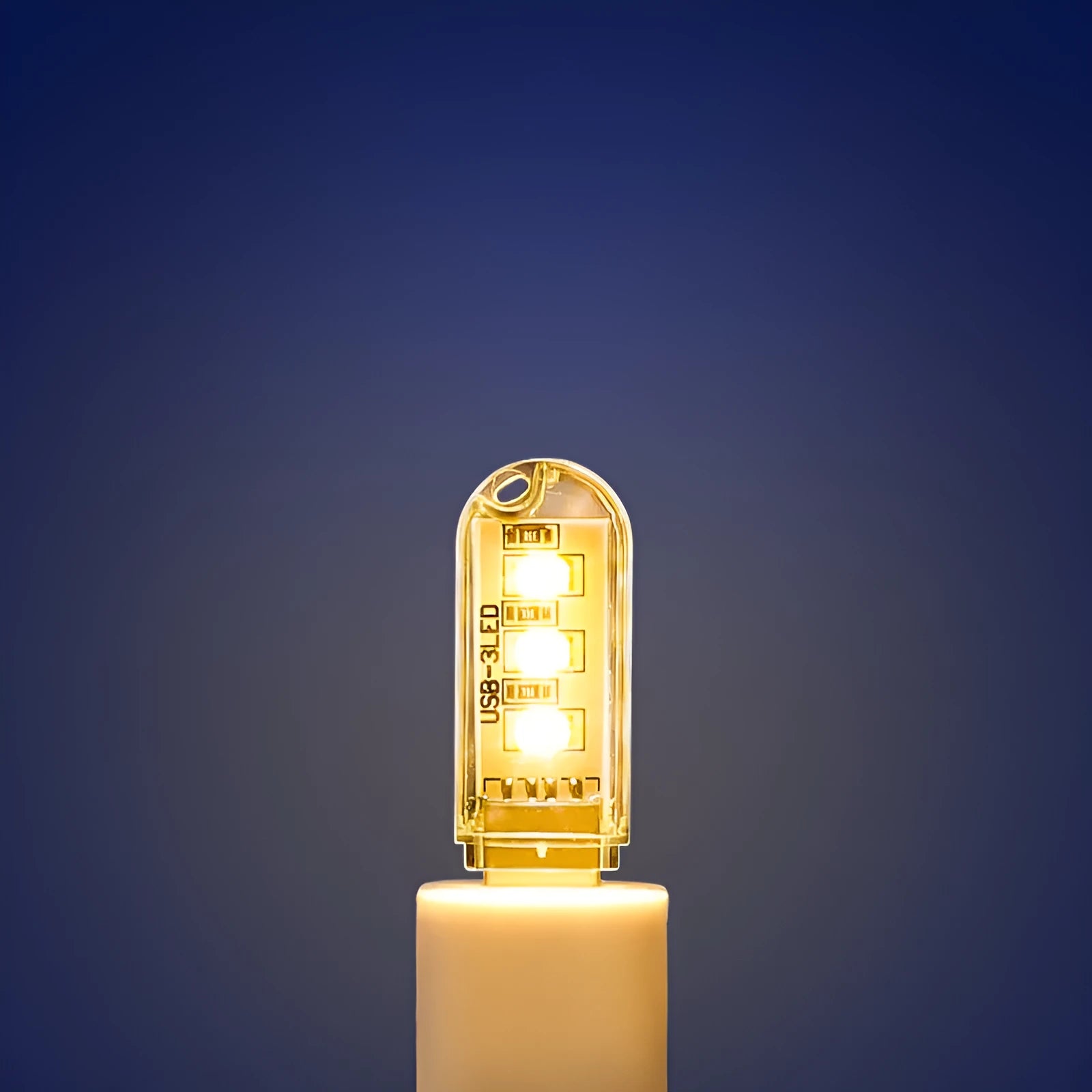 Small white USB LED night light showing warm and white light colour options