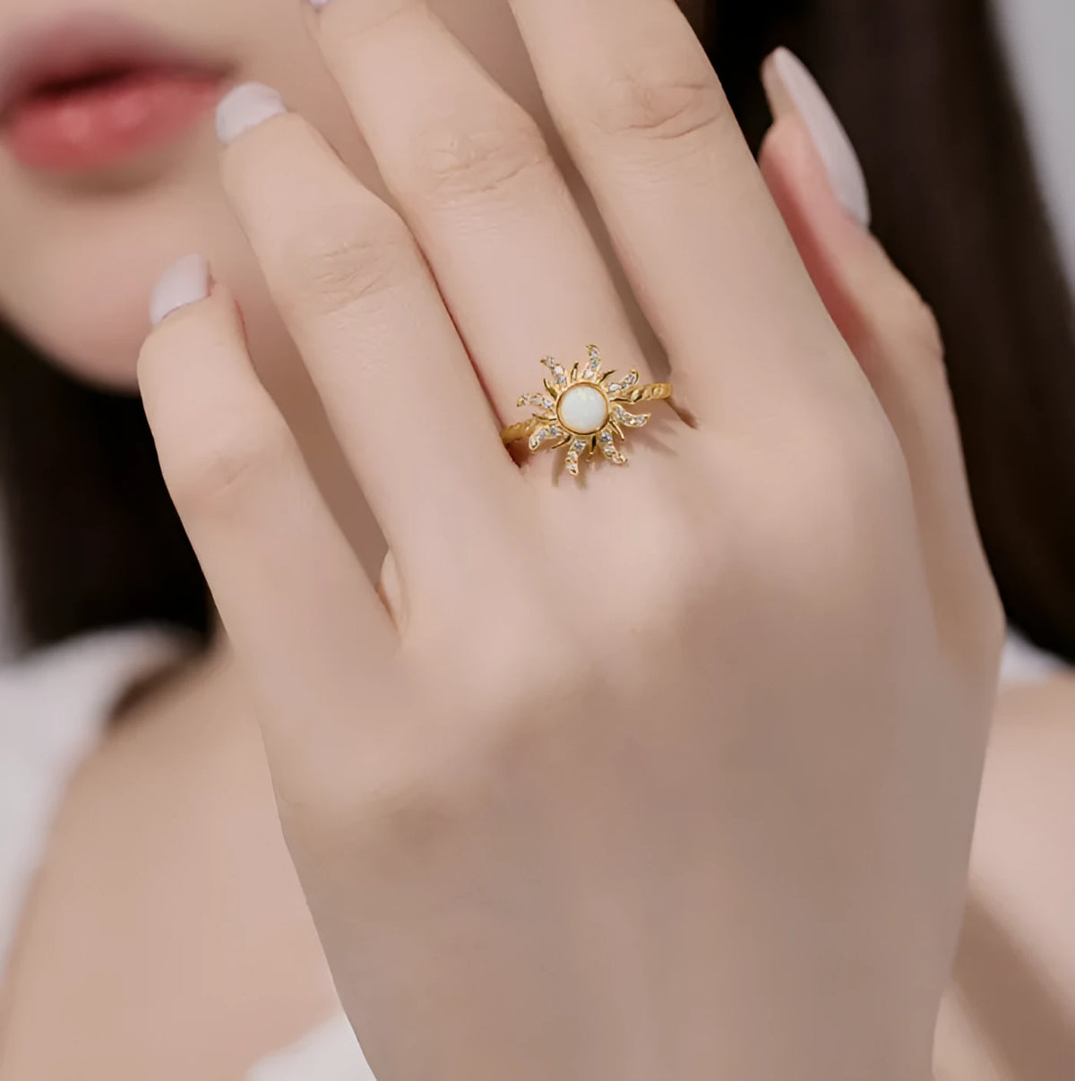 Women's silver ring with inlaid sun design and electroplated finish, shown in one of four colour options