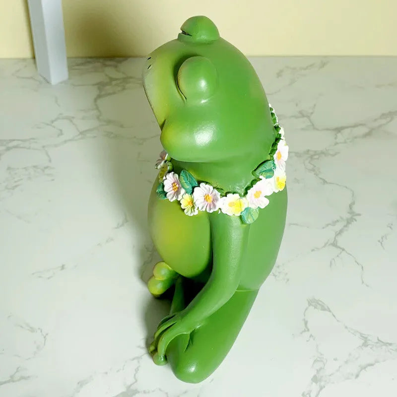 European style Magic Yoga Frog plastic and resin ornament in RDW123 colour on a shelf.