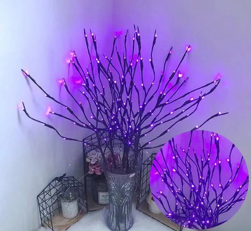 LED decorative tree light in a vase with colourful or warm white lighting options.