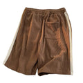 Versatile polyester sports shorts in black, apricot, and dark brown for casual summer couple wear