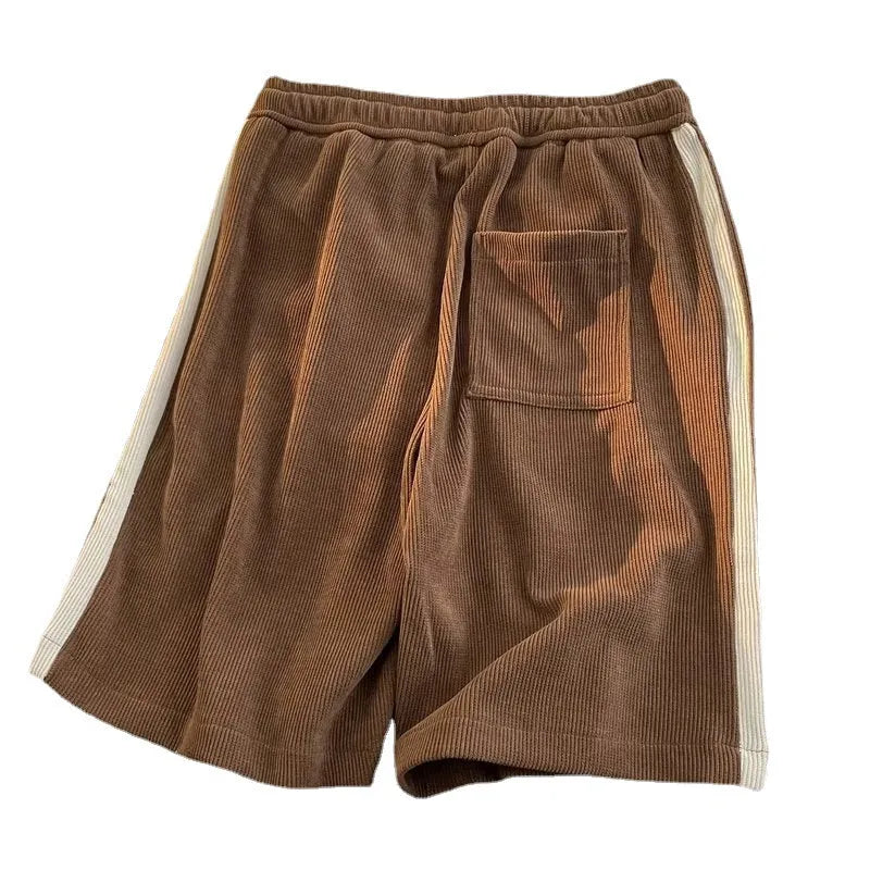 Versatile polyester sports shorts in black, apricot, and dark brown for casual summer couple wear