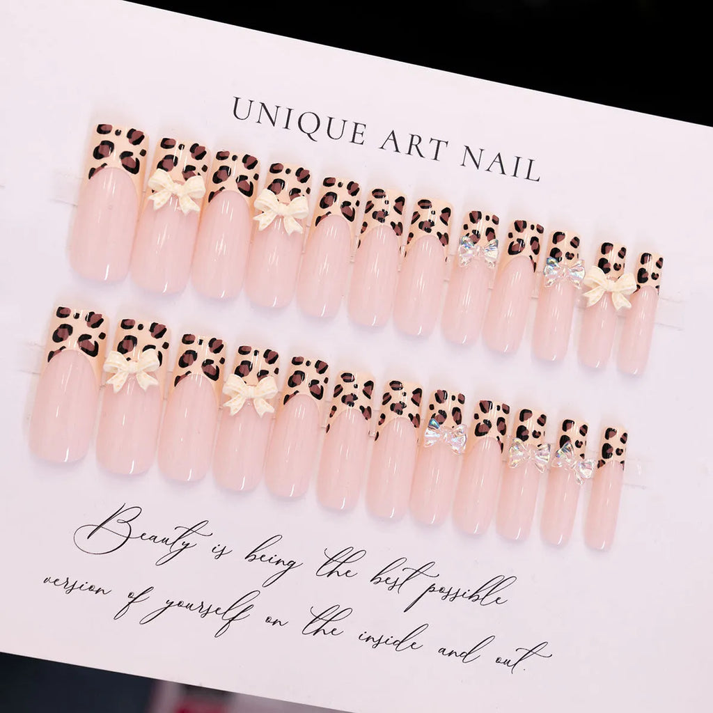 Leopard print false nails with butterfly wing designs, 24 piece plastic nail art set in WM296 colour