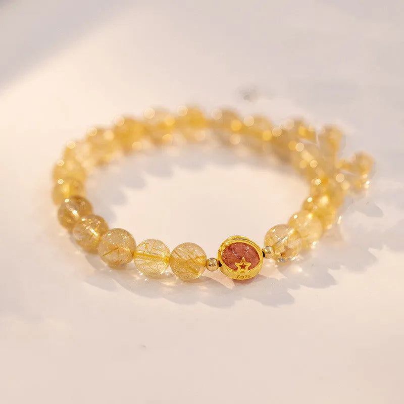 Gold rutilated quartz bracelet with diamond-cut beads in two size options