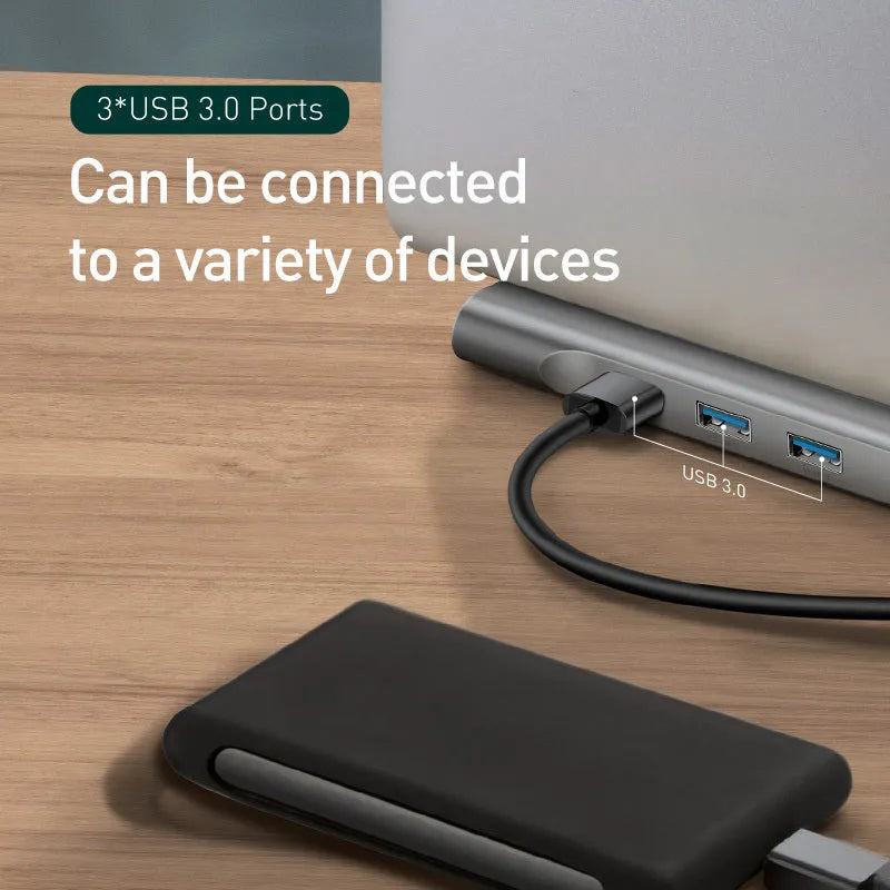 Grey aluminium ten-port USB C docking hub with cooling bracket, showing HDMI, VGA, Ethernet, and USB ports.
