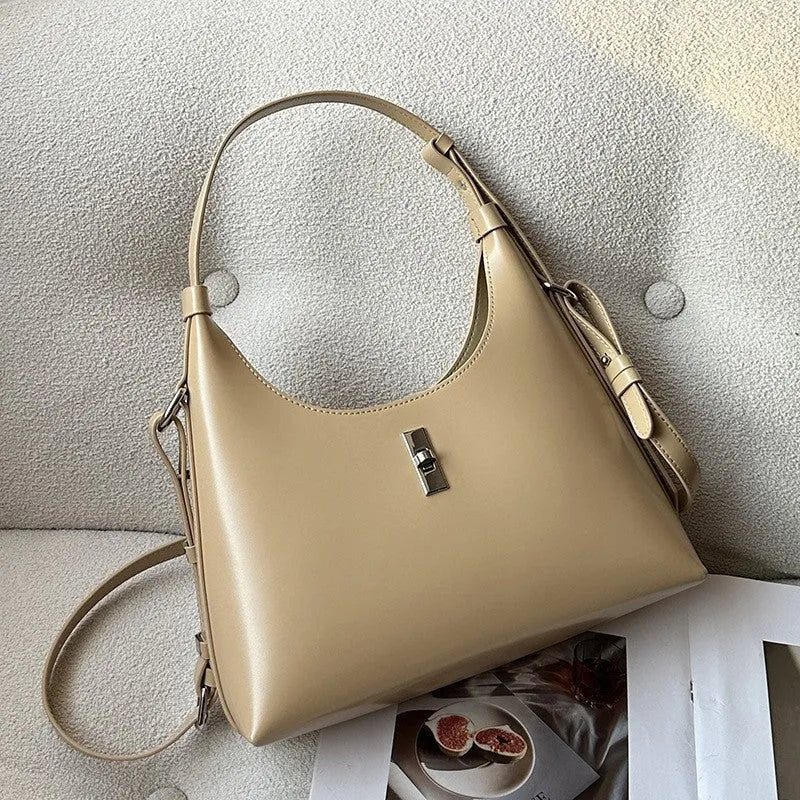 Soft genuine leather crossbody shoulder bag in a dumpling shape, shown in one of six available colours.