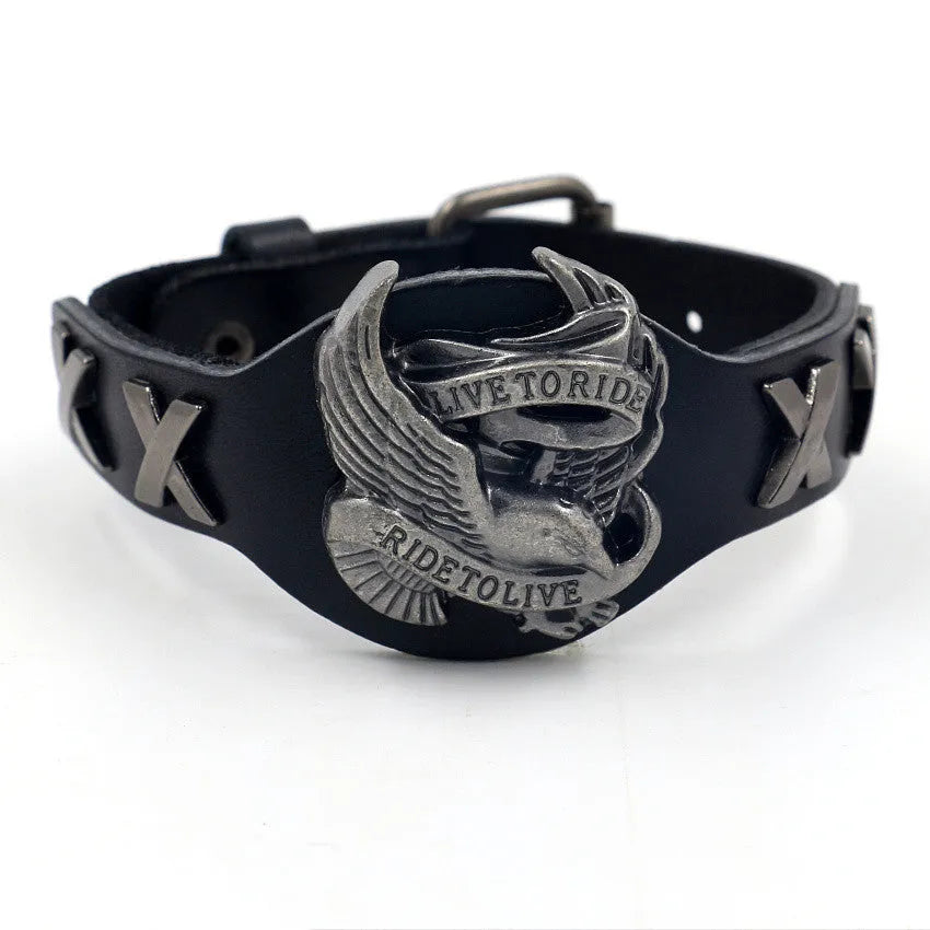 Black geometric bracelet with eagle watch-button closure on leather strap showing adjustable width design