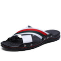 Men's leather flip-flops in black on a white background, showing cowhide upper and textured PU sole.