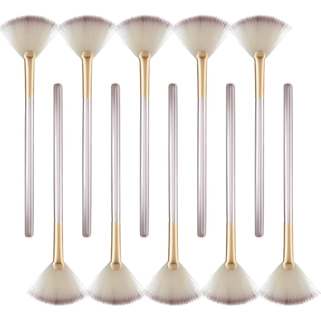 Ten champagne-coloured facial fan brushes with acrylic handles and protective covers