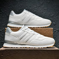 Men's casual running sports shoes with carved wing pattern in black and white space leather