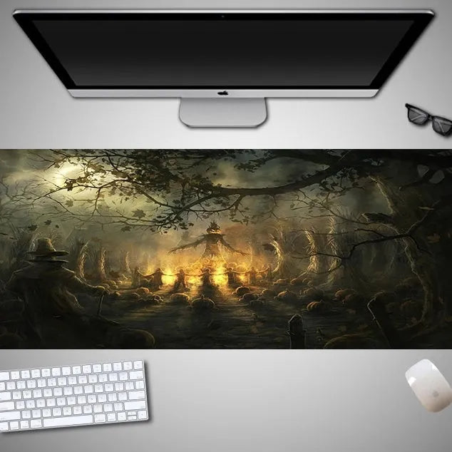 Oversized Halloween-themed gaming mouse pad on a desk, showing anti-slip base and graphic design.