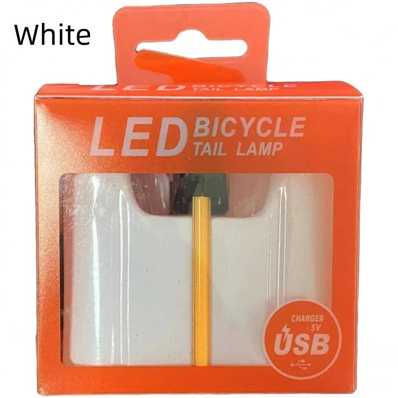 USB rechargeable waterproof bicycle rear light in yellow, red, blue, pink, or white colour options.