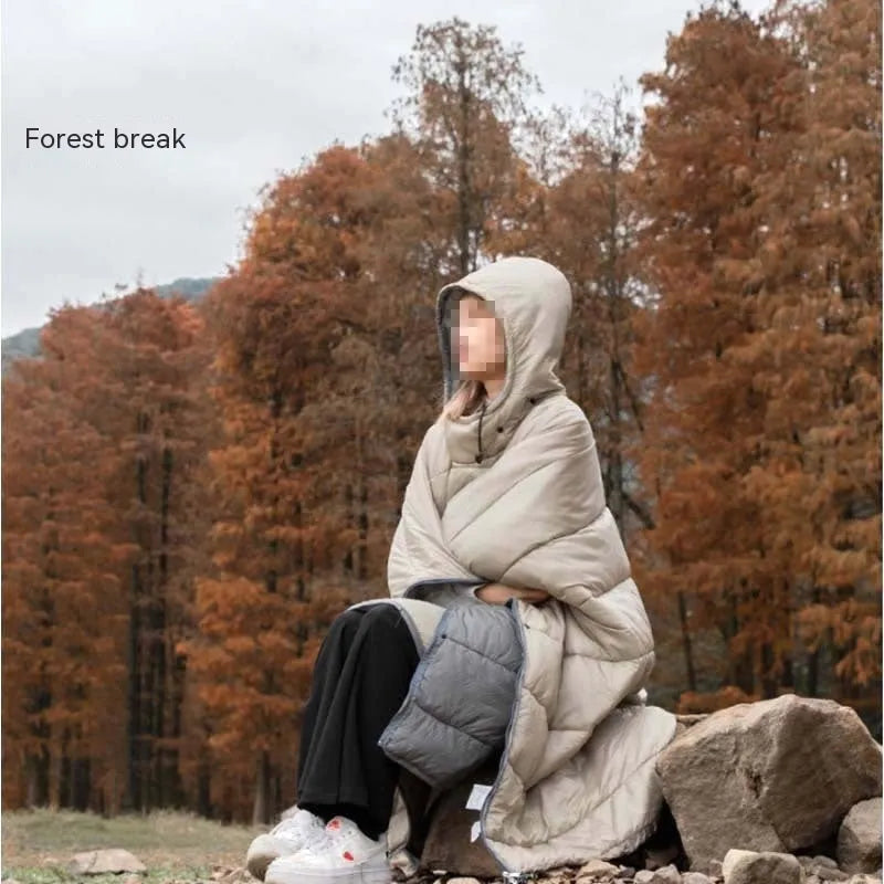 Outdoor cloak sleeping bag in grey laid out flat showing its 200x140cm rectangular shape.