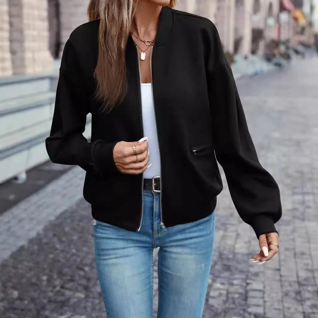 Black women's casual zip jacket with long sleeves and faux pocket detail