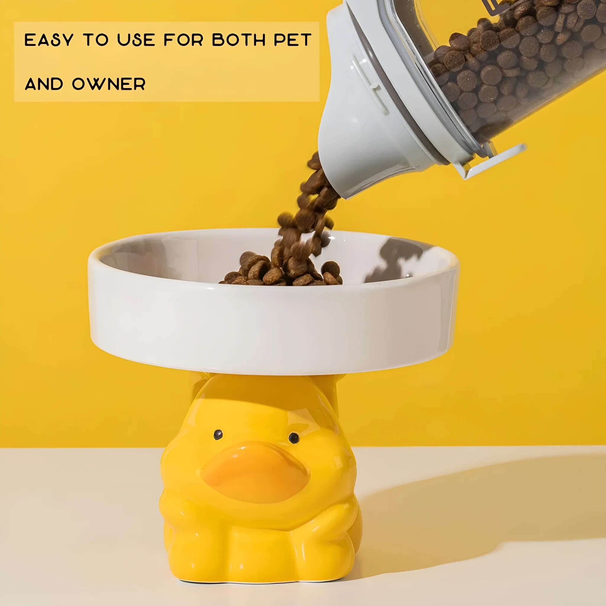 Raised ceramic cat bowl with animal design in pink, yellow, or white, showing wide rim.