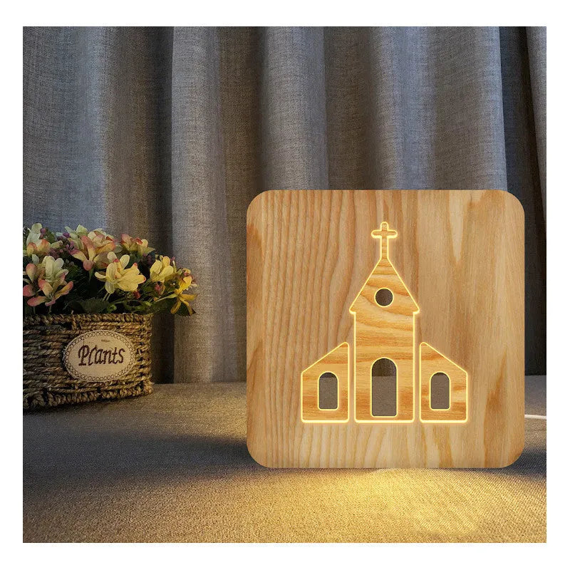 Solid wood hollow LED night lamp warm white with USB cable on wooden surface