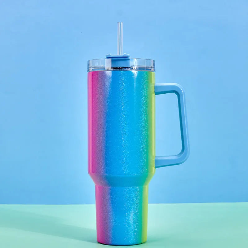 Large stainless steel vacuum insulation cup showing gradient colour options on a white background.