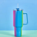 Large stainless steel vacuum insulation cup showing gradient colour options on a white background.